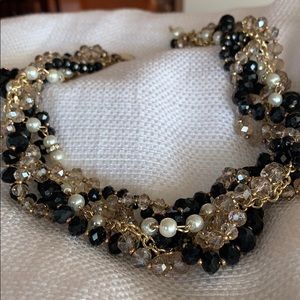 Twisted multistrand necklace gold pearl and black